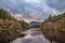 Stunning landscape image of Glencoe Lochan with Pap of Glencoe in the distance on a Winter\\\'s evening