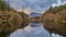 Stunning landscape image of Glencoe Lochan with Pap of Glencoe in the distance on a Winter`s evening