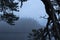 Stunning landscape image of misty Derwentwater in Lake District on cold Winter morning