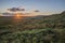 Stunning landscape image of Stanage Edge during Summer sunset in