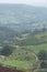 Stunning landscape image of the view from Higger Tor in the Peak District National Park in Egnland with light fog across the