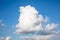 Stunning large cloud piercing into the blue sky