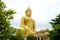 Stunning Large Golden Sitting Buddha Image at Wat Muang Temple in Ang Thong Province of Thailand