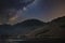 Stunning majestic digital composite landscape of Milky Way over Buttermere in Lake District