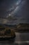 Stunning majestic digital composite landscape of Milky Way over Hawes Water in Lake District