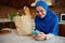 Stunning Middle-Eastern Muslim woman in hijab, using smartphone, checks content on social media, expenses in mobile apps