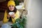 Stunning Middle Eastern woman in yellow jacket and hat, takes sip of hot drink, enjoys outdoor coffee break on fall day