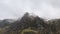 Stunning moody dramatic Winter landscape image of snowcapped Y Garn mountain in Snowdonia