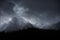 Stunning moody dramatic Winter landscape image of snowcapped Y Garn mountain in Snowdonia