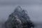 A stunning, mysterious peak shrouded in mist at Rila mountain in Bulgaria. Maliovica