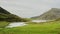 Stunning natural mountain landscape scenery of Cwm Idwal Lake in Glyderau range of Snowdonia, pan r