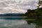 Stunning nature landscape of Bled Lake. Ancient Castle on the top of the rock. Famous island with church at the background