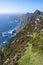 Stunning nature scene of Achill island, county Mayo, Ireland. Green hills and blue sky and ocean surface. Irish landscape. Warm