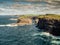 Stunning nature scene with cliffs, Atlantic ocean and low cloudy sky on sunny day. Kilkee area, Ireland. Travel, tourism and