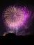 Stunning night sky illuminated with an array of colorful purple and white fireworks