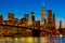 Stunning night-time view of the iconic Brooklyn Bridge in New York City, illuminated by city lights