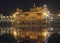 Stunning night view of golden temple, reflection of light
