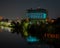 Stunning nighttime urban landscape of tall buildings illuminated against the night sky