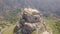 Stunning orbit 4k aerial of rock with Catholic cross in Bova, Calabria, Italy