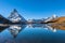 Stunning panorama view of the famous Matterhorn and Weisshorn peak of Swiss Pennine Alps with beautiful reflection in Riffelsee
