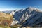 Stunning panorama view of a gorgeous Alpine mountain range on a sunny autumn day