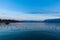 Stunning panorama view of Lake Leman Lake Geneva at dusk in autumn in Lausanne, with beautiful snow covered French Alps mountain