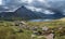Stunning panoramic landscape image of countryside around Llyn Ogwen in Snowdonia during early Autumn with Tryfan in background