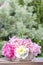 Stunning peonies in white wicker basket