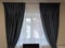 This stunning photograph showcases beautiful curtains that would be the perfect addition to any home