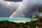 Stunning rainbow in stormy skies over the ocean