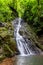 Stunning Rainmaker Waterfalls with Green Trees Rushing Water