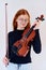 Stunning Redhead Musician Poses with Violin in Captivating Portrait