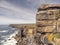 Stunning rough stone cliff and Atlantic ocean. Aran island, county Galway, Ireland. Rugged coastline. Irish nature scene. Popular