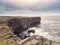 Stunning rough stone cliff and Atlantic ocean. Aran island, county Galway, Ireland. Rugged coastline. Irish nature scene. Popular
