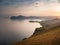 Stunning scenery in the sunset rays of the sea coast and mountains