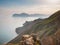 Stunning scenery in the sunset rays of the sea coast and mountains