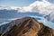 Stunning scenic views of the bays of Lake Wanaka and the snow capped Southern Alps from the Roys Peak mountain track