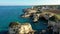 Stunning seascape with cliffs rocky arch and stacks (Faraglioni) at Torre Sant Andrea, Salento coast, Puglia region