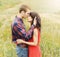 Stunning sensual outdoor portrait of young attractive couple in