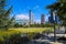 A stunning shot of the buildings and skyscrapers in the cityscape of downtown Atlanta with lush green grass and trees