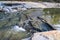 A stunning shot of the clear river water rushing over the rocks