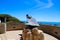 A stunning shot of the The Hide Drogher statue on the Dana Point Bluff Top Trail with a majestic view of the blue ocean water