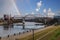 A stunning shot of the riverfront with a gorgeous view of the Cumberland river with a steam boat on the river and bridges