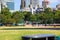 A stunning shot of the skyscrapers and office buildings in downtown Atlanta and Centennial Olympic Park with lush green trees