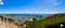 A stunning shot of the vast blue ocean water with white boats and yachts docked in the harbor and sailing in the harbor