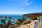 A stunning shot of the vast blue ocean water with white boats and yachts docked in the harbor and sailing in the harbor