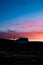 Stunning skies and crescent moon above a lonely house