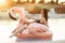 Stunning slim girl is wearing black bikini sitting in swimming pool with blue water on a pink flamingo mattress over