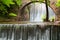 Stunning spring landscape.Paleokarya, old, stone, arched bridge, between two waterfalls.