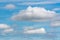 Stunning summer clouds floating across sunny blue sky to change weather